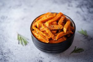 sweet potato sticks, baked sweet potato fries, oven fries, crispy oven-baked, healthy side, high fiber, beta-carotene, vitamin A, weeknight recipe, simple ingredients, minimal oil, cornstarch coating, gluten free, dairy free option, vegan option, meal prep, snack, game day, family friendly, kid friendly, savory spice blend, smoked paprika, garlic powder, onion powder, maple mustard dip, yogurt lime dip, sheet pan recipe, two-stage bake, convection friendly, affordable, pantry staples, olive oil, quick soak method, crispy edges, tender center, golden brown, sweet and spicy, chili powder, cayenne, easy cleanup, parchment lined, reheating tips, dipping sauces, balanced flavor, wholesome, real food, plant-based, vegetarian, veggie side, seasonal cooking, fall recipes