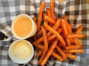 sweet potato sticks, baked sweet potato fries, oven fries, crispy oven-baked, healthy side, high fiber, beta-carotene, vitamin A, weeknight recipe, simple ingredients, minimal oil, cornstarch coating, gluten free, dairy free option, vegan option, meal prep, snack, game day, family friendly, kid friendly, savory spice blend, smoked paprika, garlic powder, onion powder, maple mustard dip, yogurt lime dip, sheet pan recipe, two-stage bake, convection friendly, affordable, pantry staples, olive oil, quick soak method, crispy edges, tender center, golden brown, sweet and spicy, chili powder, cayenne, easy cleanup, parchment lined, reheating tips, dipping sauces, balanced flavor, wholesome, real food, plant-based, vegetarian, veggie side, seasonal cooking, fall recipes