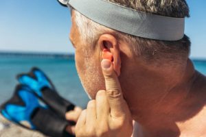 swimmer’s ear, acute otitis externa, otitis externa, ear canal infection, water exposure, humidity, Pseudomonas aeruginosa, Staphylococcus aureus, otomycosis, fungal infection, ear pain, pruritus, otorrhea, tragal tenderness, pinna pull pain, canal edema, canal erythema, conductive hearing loss, cerumen, Q-tip injury, contact dermatitis, eczema, psoriasis, prevention, acidifying drops, acetic acid, isopropyl alcohol drying drops, ear plugs, hair-dryer (cool) drying, aural toilet, microsuction, ear wick, topical antibiotics, fluoroquinolone drops, neomycin/polymyxin B/hydrocortisone, ciprofloxacin–dexamethasone, ofloxacin, topical steroid, analgesics, NSAIDs, avoid ototoxic drops, tympanic membrane perforation, tympanostomy tubes, culture refractory cases, malignant otitis externa, skull base osteomyelitis, diabetes risk, cranial nerve palsy, ENT referral, no swimming during treatment