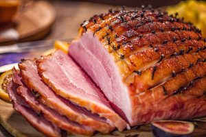 honey-glazed baked ham, baked ham, honey glaze, brown sugar, Dijon mustard, cloves, spiral-sliced ham, apple cider, orange zest, city ham, country ham, smoked ham, bone-in ham, holiday dinner, Easter ham, Christmas ham, centerpiece, roasting, scoring, studding, soaking, internal temperature, food safety, USDA guidelines, leftovers, sandwiches, pan sauce, apple cider vinegar, cinnamon, nutmeg, cayenne, butter, roasting pan, foil tent, resting time, carving, spiral ham, oven temperatures, classic recipe, easy recipe, family meal, Sunday supper, ham history, Roman cuisine, curing, smoking, wet-cured, dry-cured, sweet-savory, crowd-pleaser